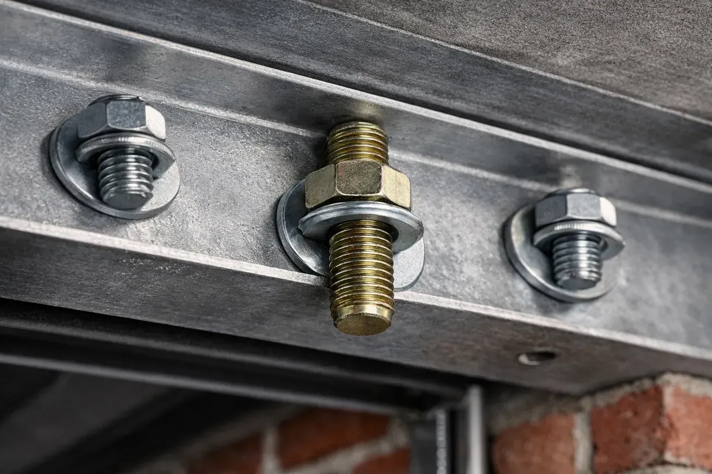 3-point mechanical lock system with structural bolts securing steel lintel above garage door