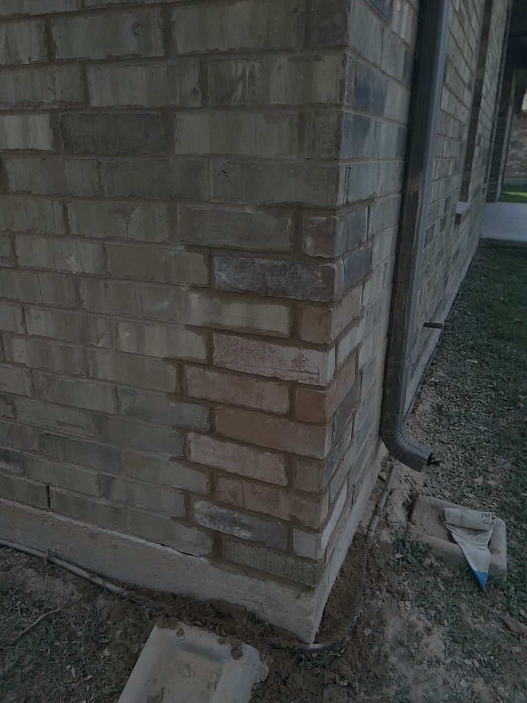 Repaired exterior corner with foundation crack