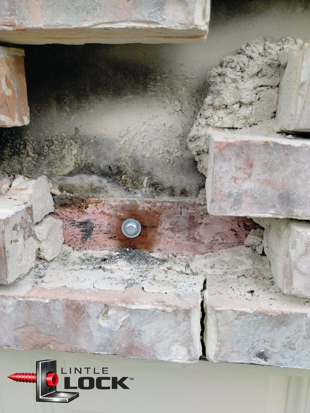 Exposed brick wall above garage door with LintleLOCK™ system