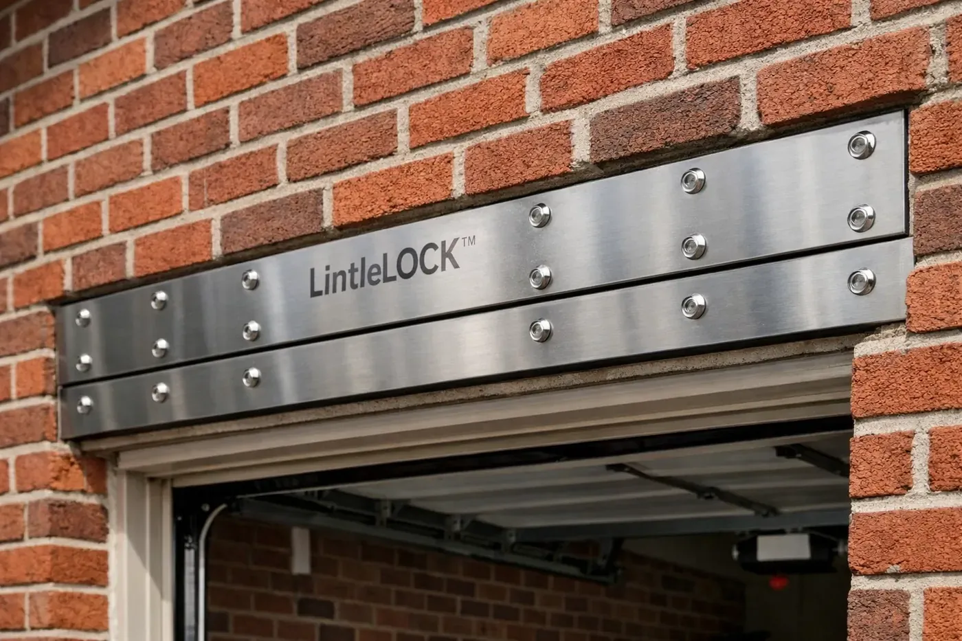 LintleLOCK™ stainless steel reinforcement system installed above garage opening in brick wall