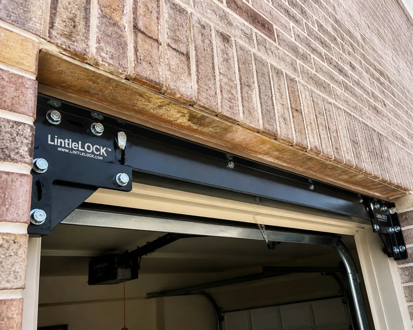 Professional LintleLOCK™ system installation correcting a sagging garage lintel for permanent Dallas brick repair.