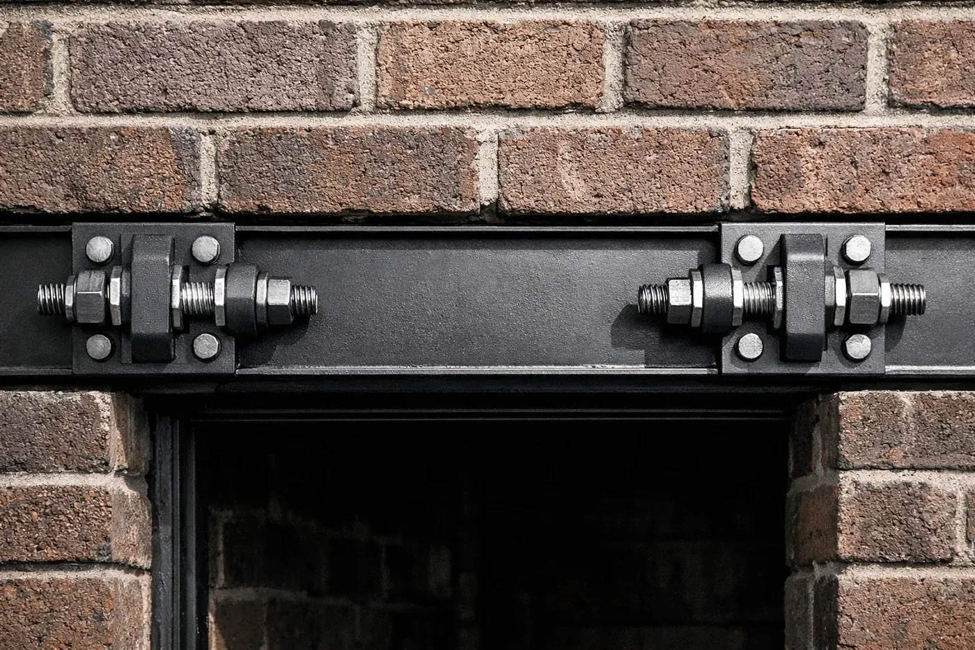 Close-up of the patented LintleLOCK system hardware installed in a brick header to fix rotational lintel failure.